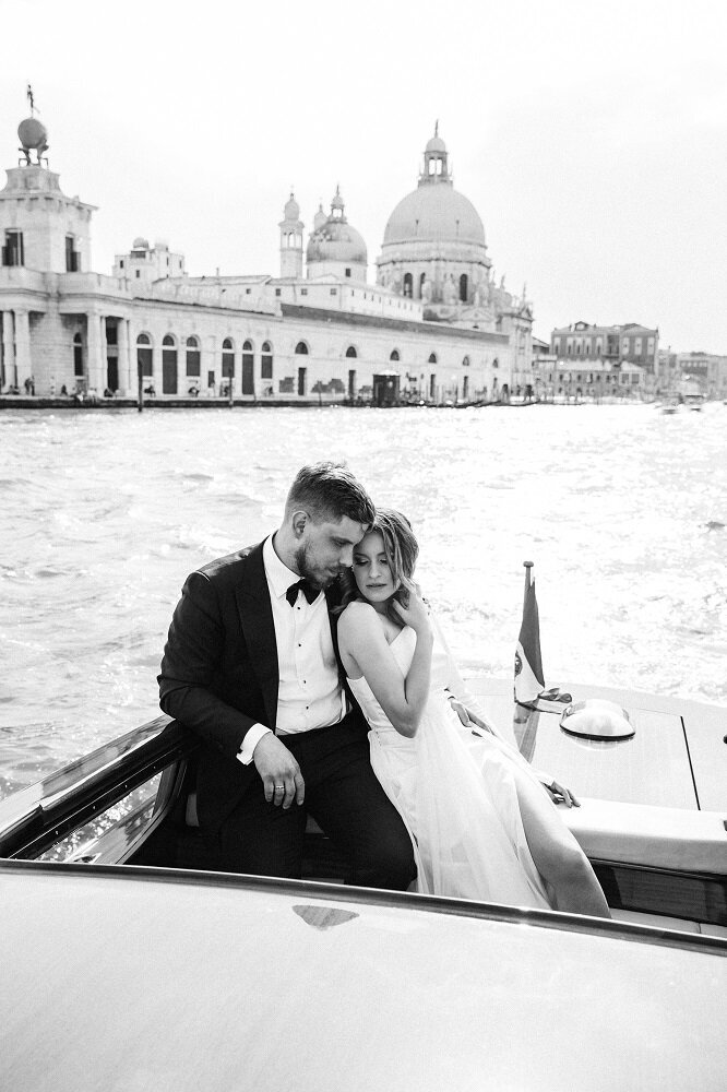 Wedding couple in a boat in Venice, Italy.