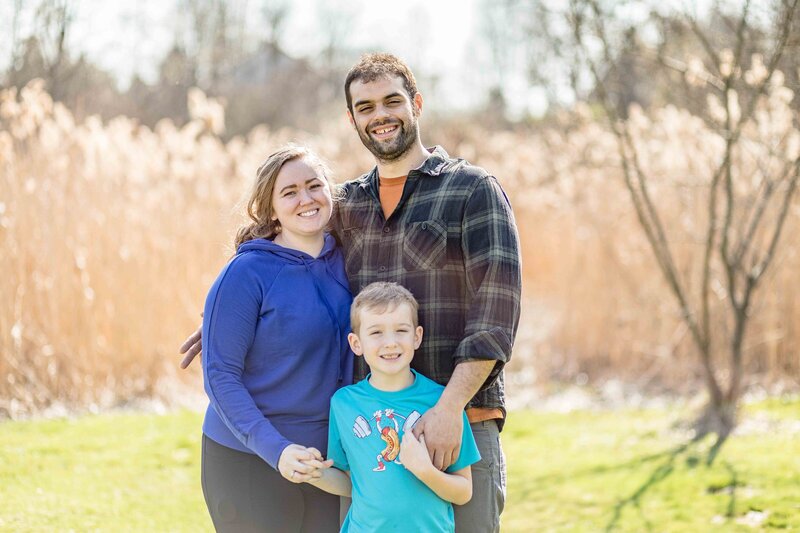 Mom and son close together at christmas tree farm