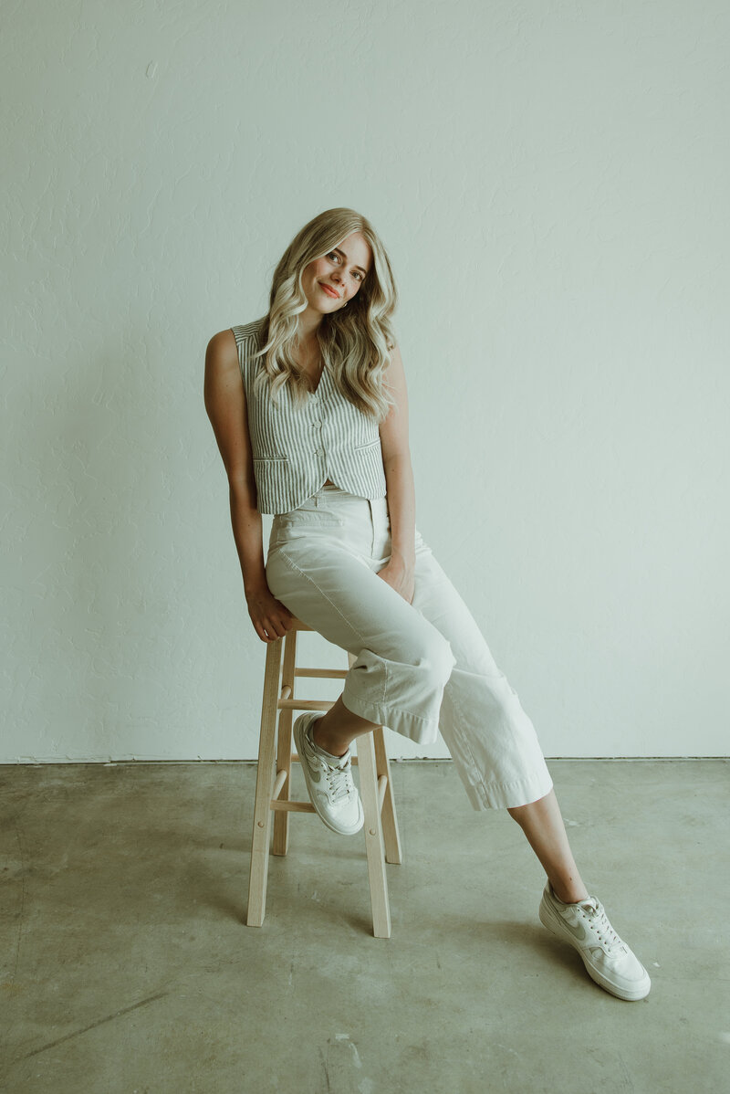 A Colorado wedding photographer sitting in the studio