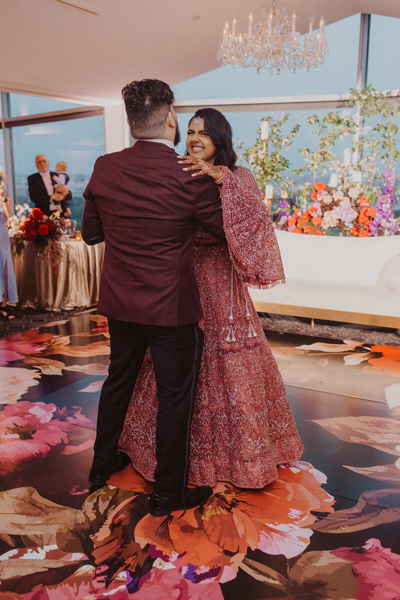 Bride and Groom share first dance at Top of the Town wedding venue in Virginia