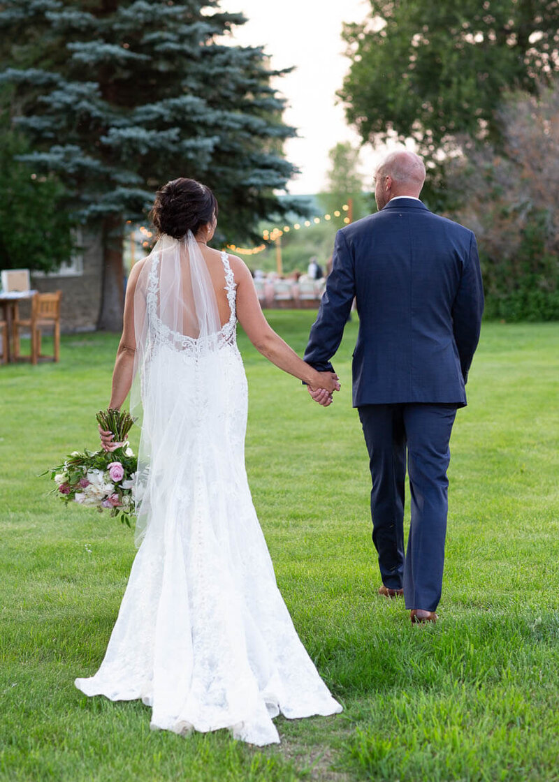 bride and groom on green lawn at Elk Hollow venue