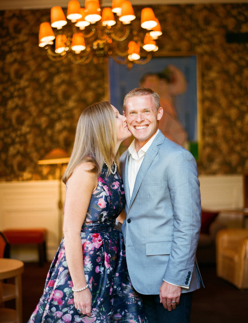 The woman kiss the groom