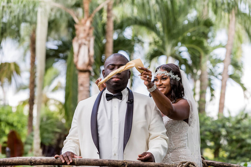 Bride revealing herself to the groom during their First Look moment at Bamboo Gallery in Davie, Florida, captured for their wedding day photo timeline.