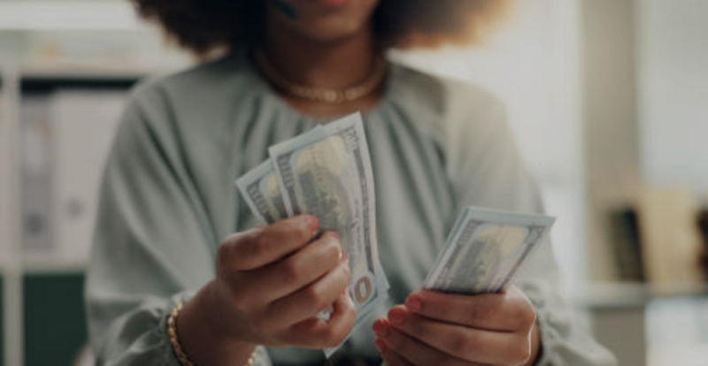 A women counting cash 