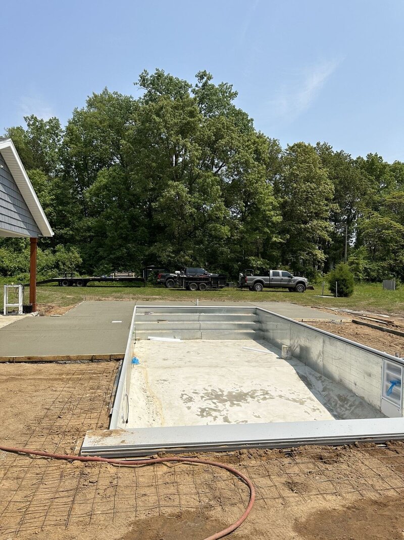 Pool deck forms: forms and wire mesh set around a new pool before the pour in Elkhart, IN