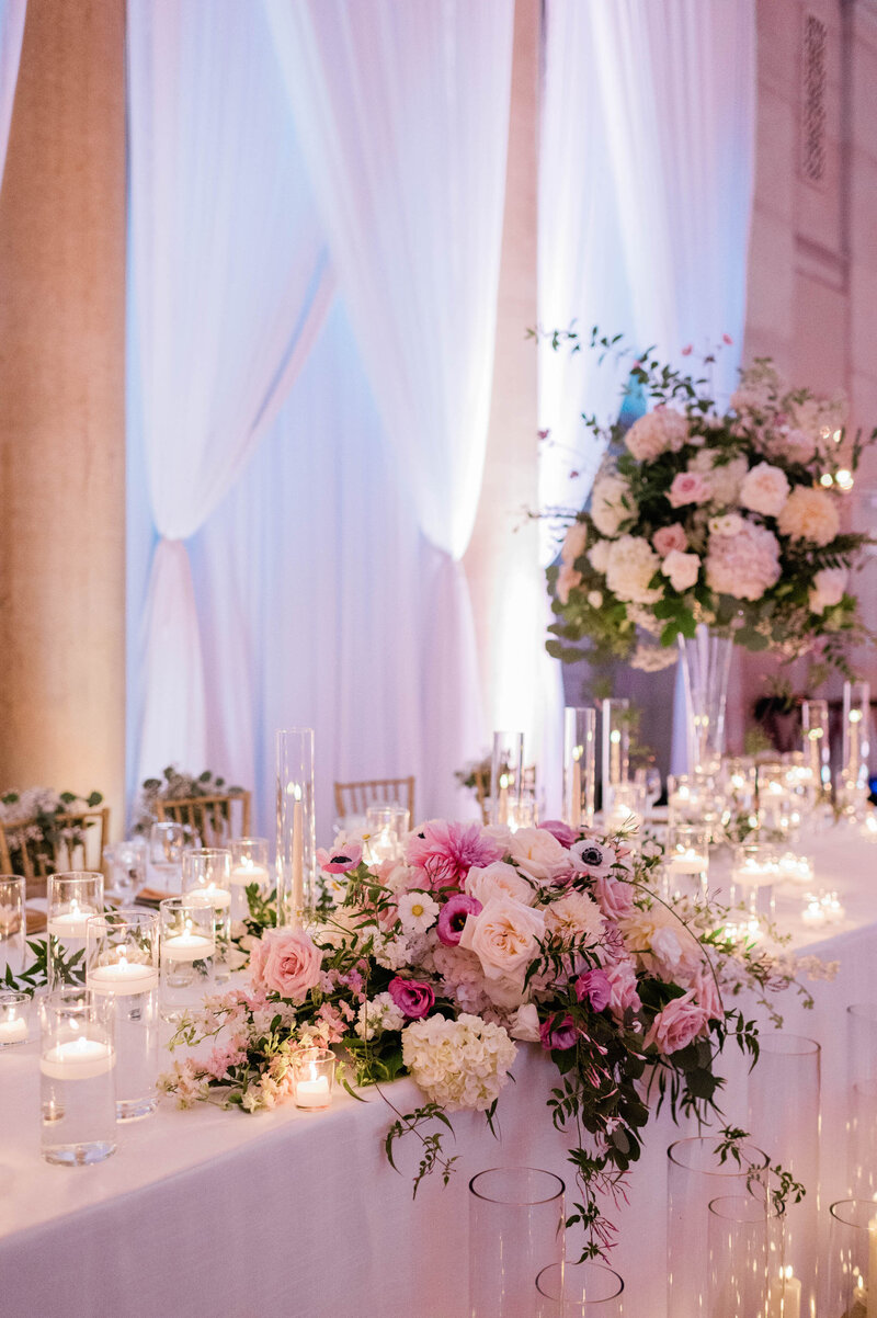 Several pink bouquets on sit on a W