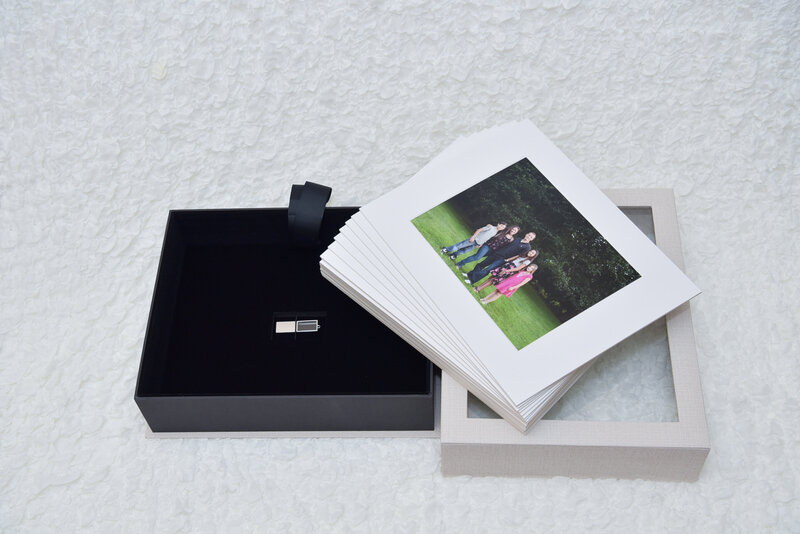 Cream window folio box with matted prints and crystal USB.
