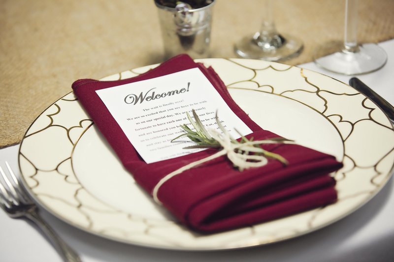 burgandy and gold place setting on private estate in the redwoods of Watsonville