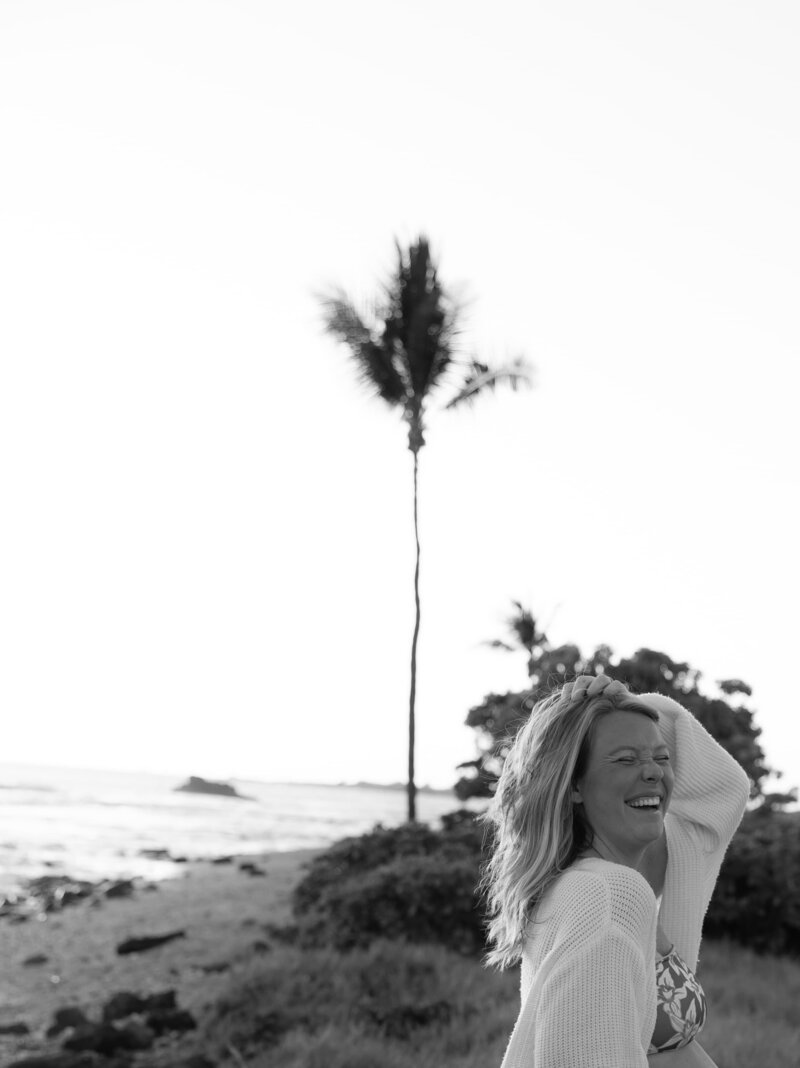 woman smiling at the cameraon the beach in Hawaii 