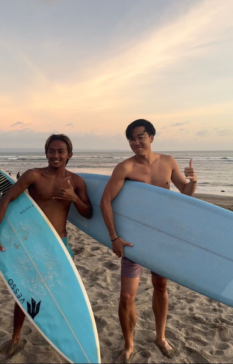 Happy surfers after riding perfect waves at Batu Bolong Beach.