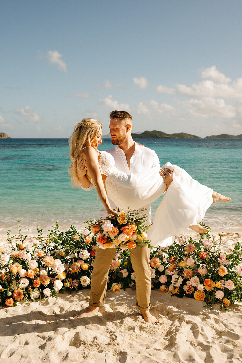 Couple on the beach at their destination wedding planned by Siena and Co Events