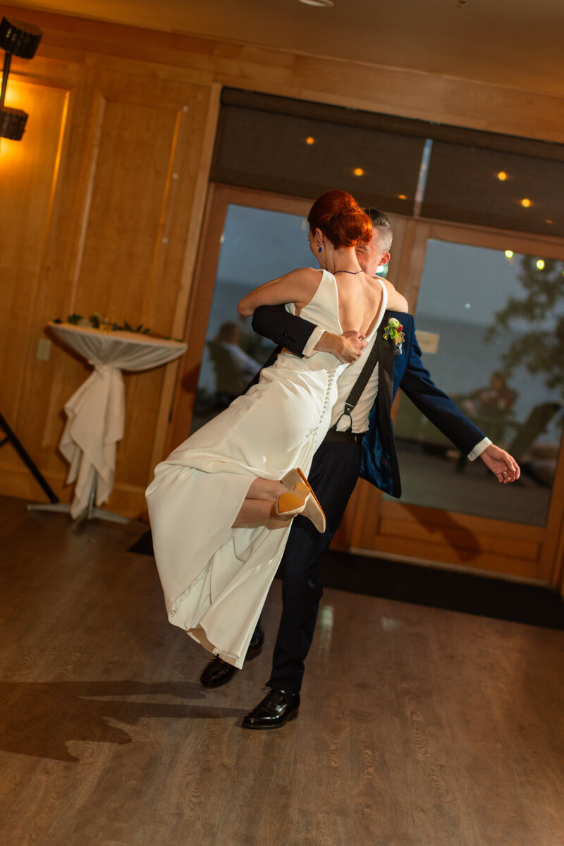 Couple spins around on the dance floor at their wedding