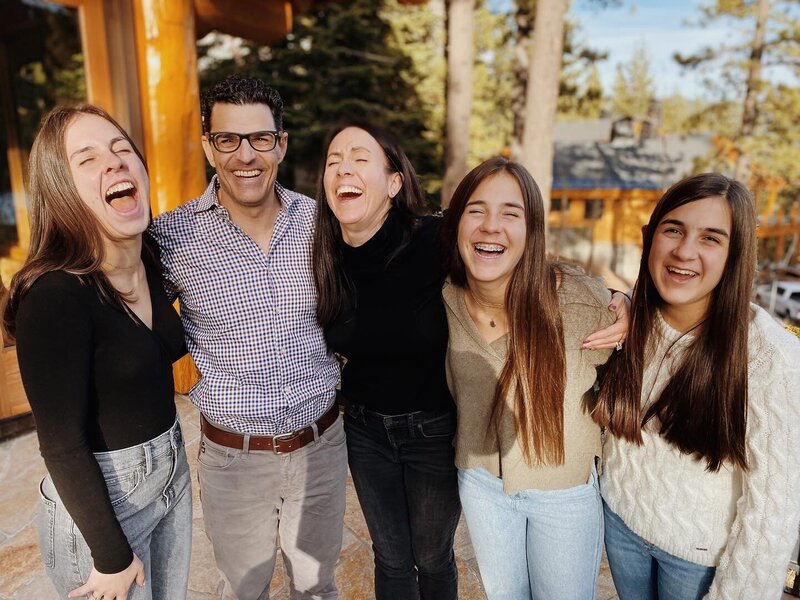 Brad laughing with his family