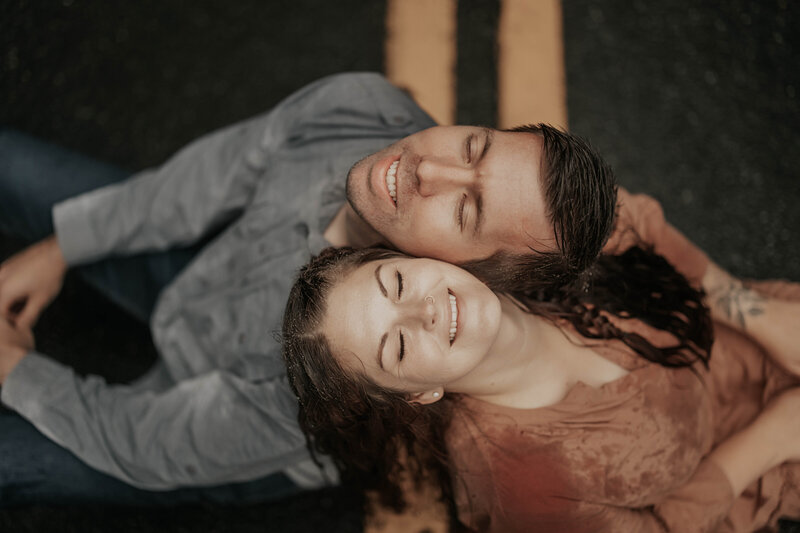 picture of a couple in the rain at sunset