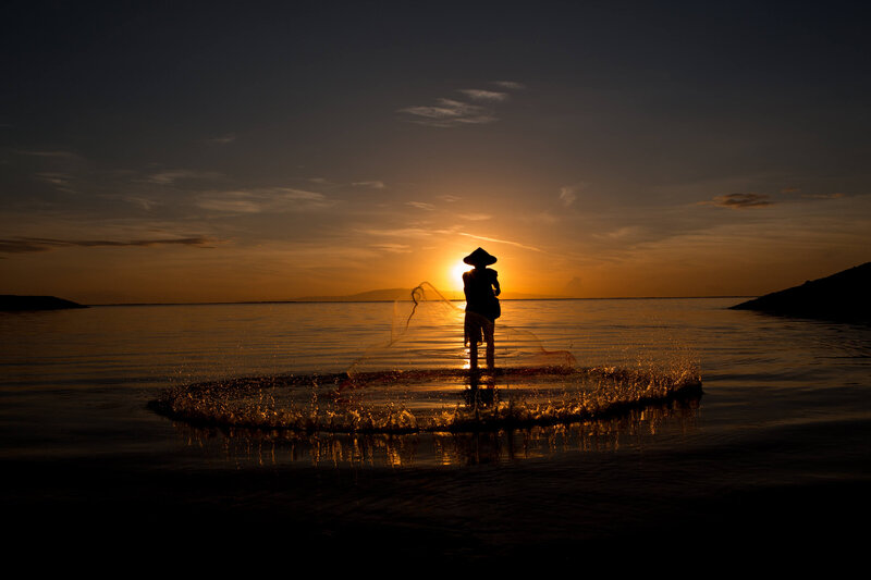 fisherman at sunrise in Bali