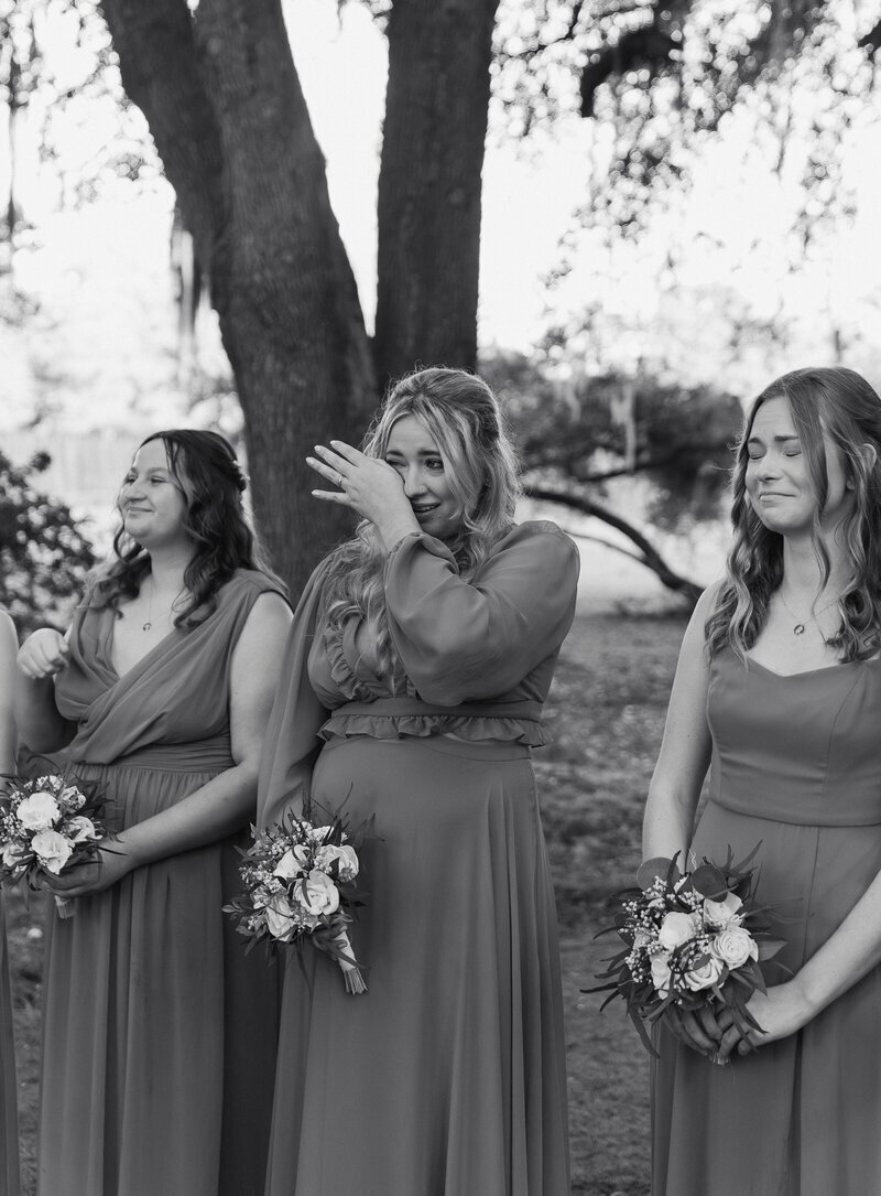 Bridesmaid crying during ceremony taken by Shelby Ann, jacksonville wedding photographer