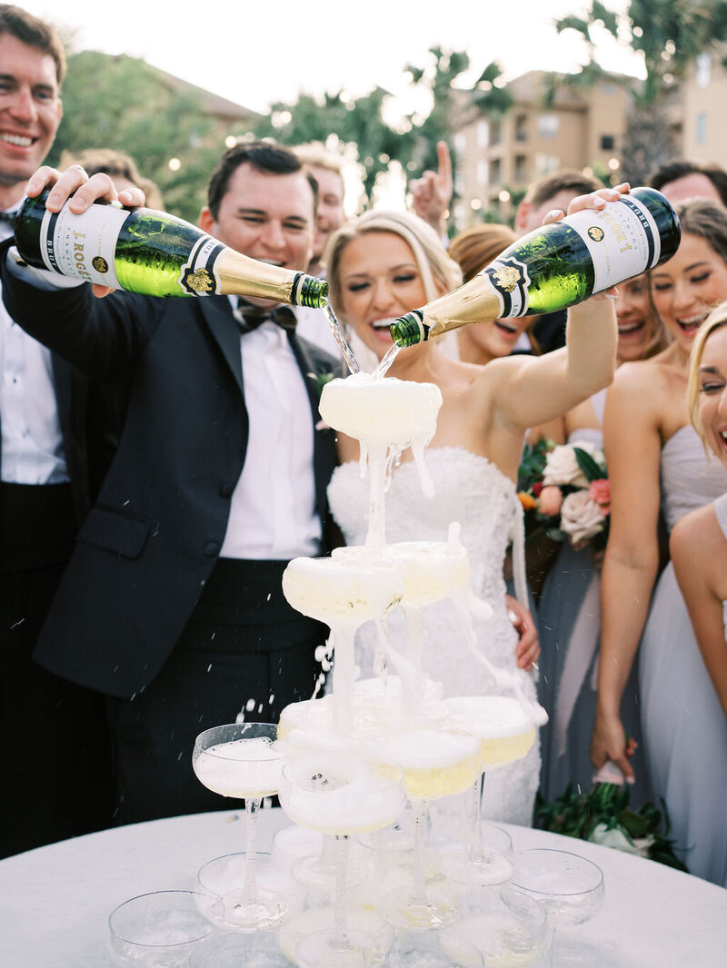 Bride and groom pouring a champagne tower