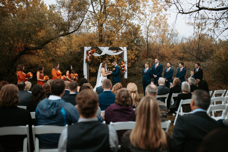 Bride by old wagon Toledo Area wedding venue Outdoor