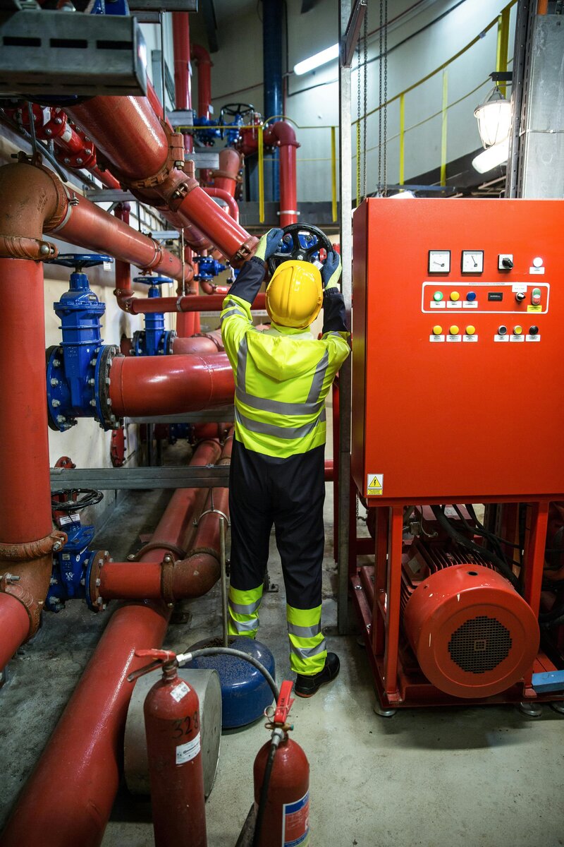 Oil and gas frontline leader consulting with equipment during a cost-saving intervention