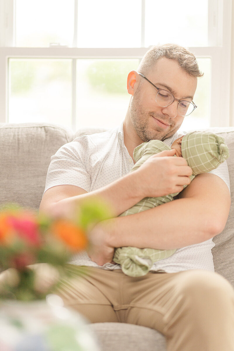 dad looking at baby adoringly during South Riding, VA newborn picture