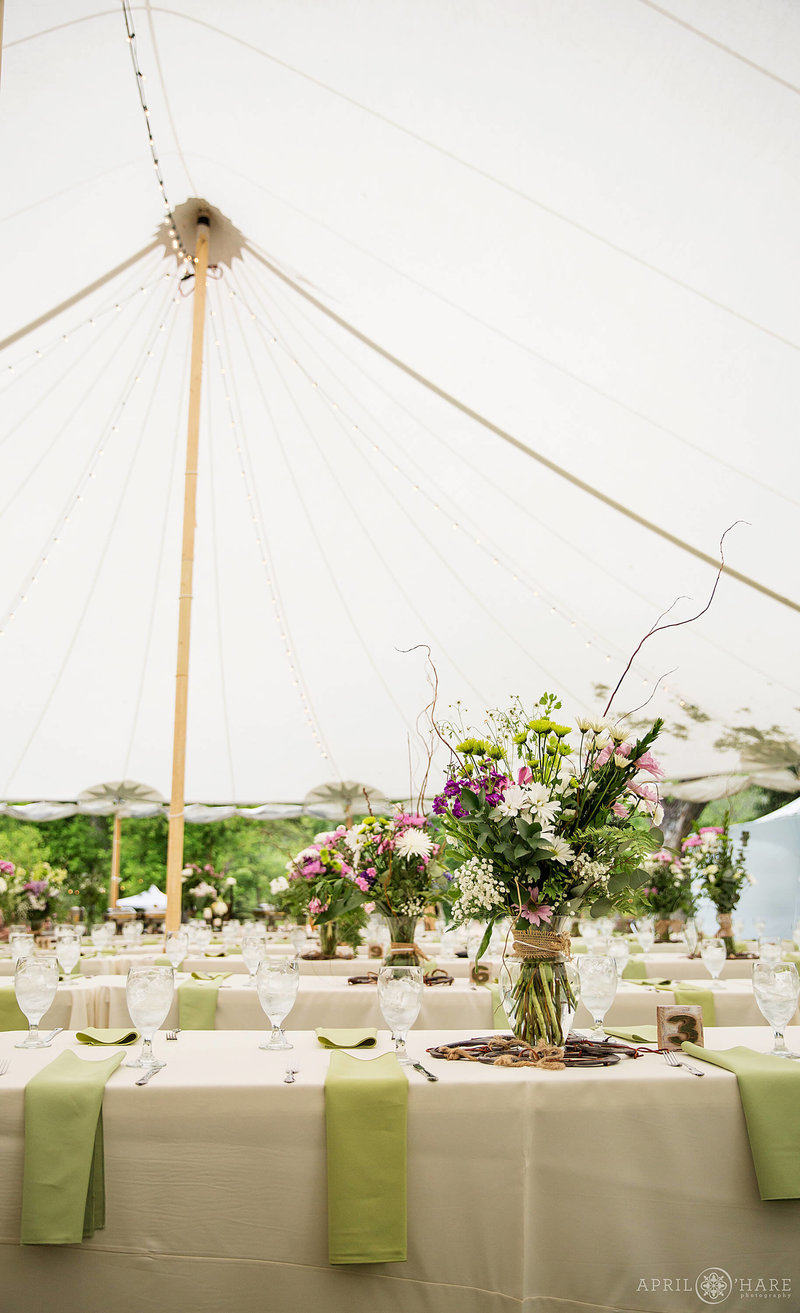 Large white tent set up for a wedding reception at Riverbend dinner reception
