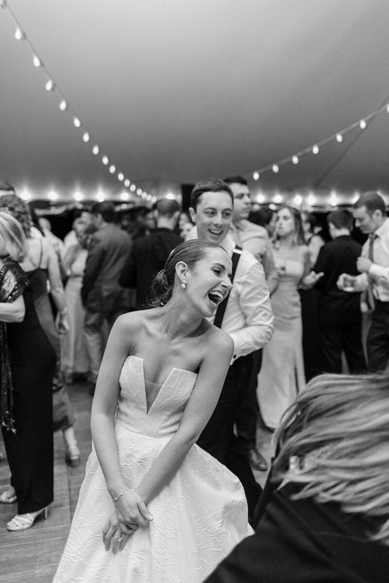 bride-laughing-tented-reception