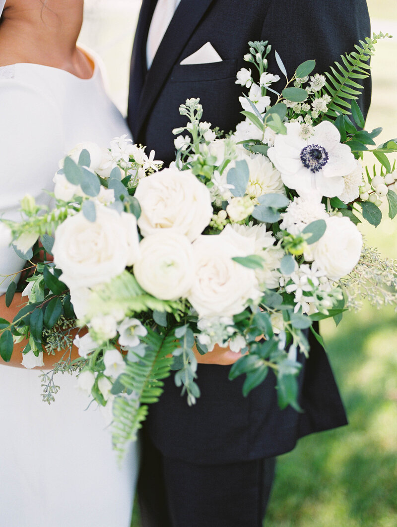 photo of beautiful white wedding bouquet, photo by Cynthia Mae Photography Grand Rapids wedding photographers