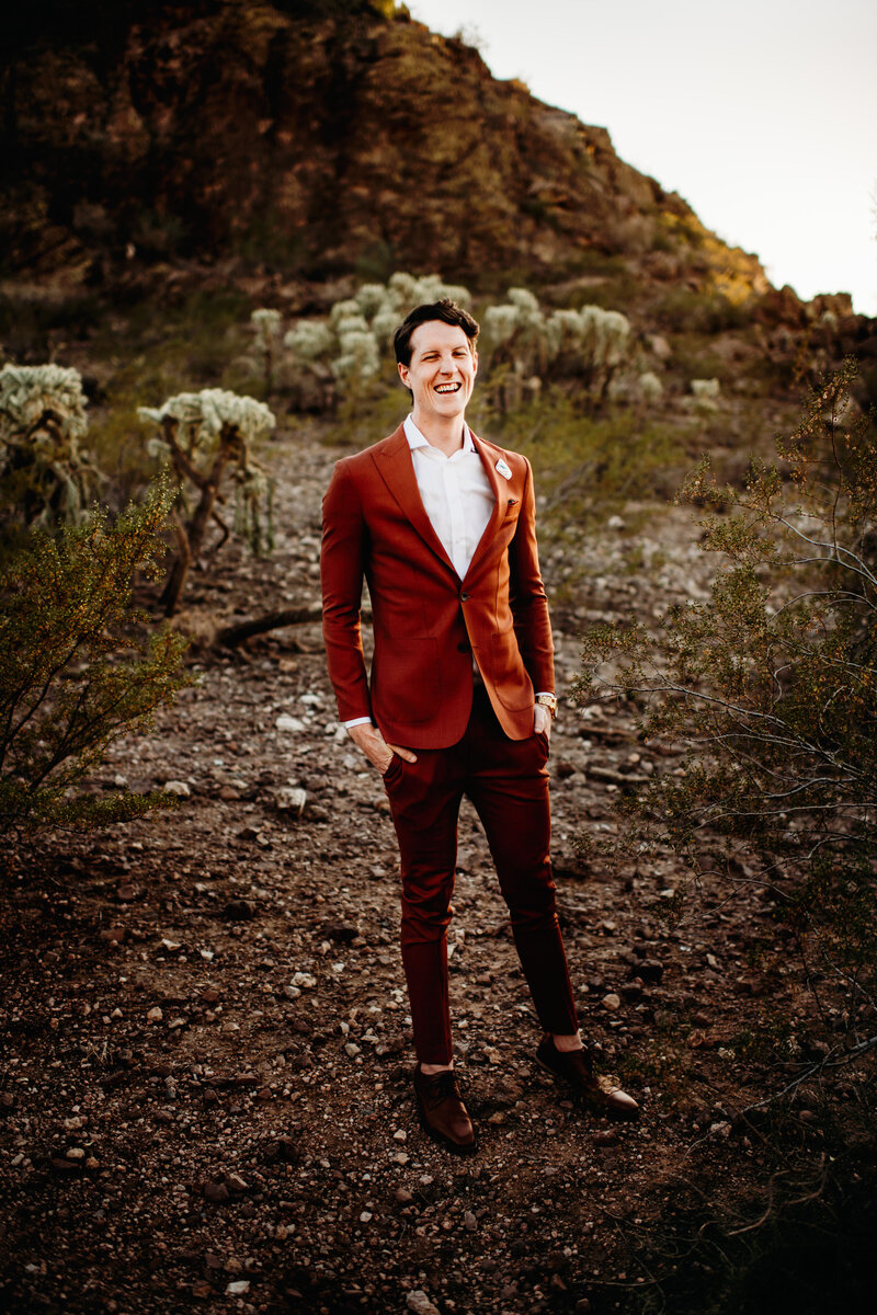 Groom standing and smiling