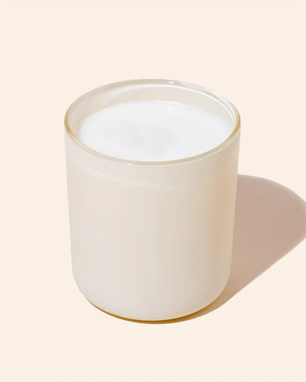 Noura Blanc Aura Candle in Cream Large 12oz on Flat Lay