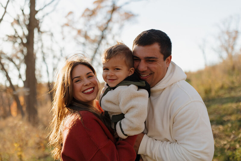 mount horeb family smiles during their fall family photo session in mount horeb wisconsin