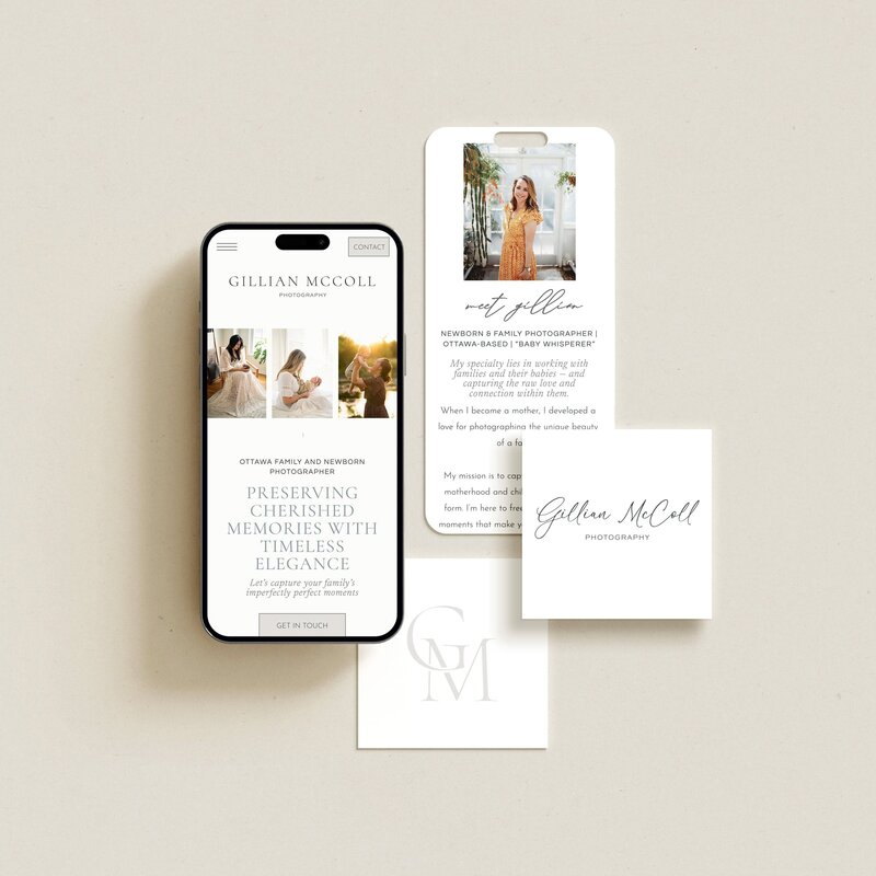 A smartphone displaying a Showit web design for luxury photographers, business cards, and promotional material is arranged on a beige background. The materials feature images of a photographer's work, showcasing family and newborn photography, highlighting their brand and identity services.