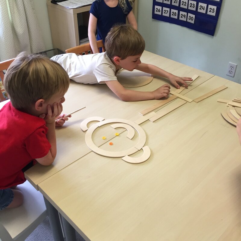 grade school children playing with shapes