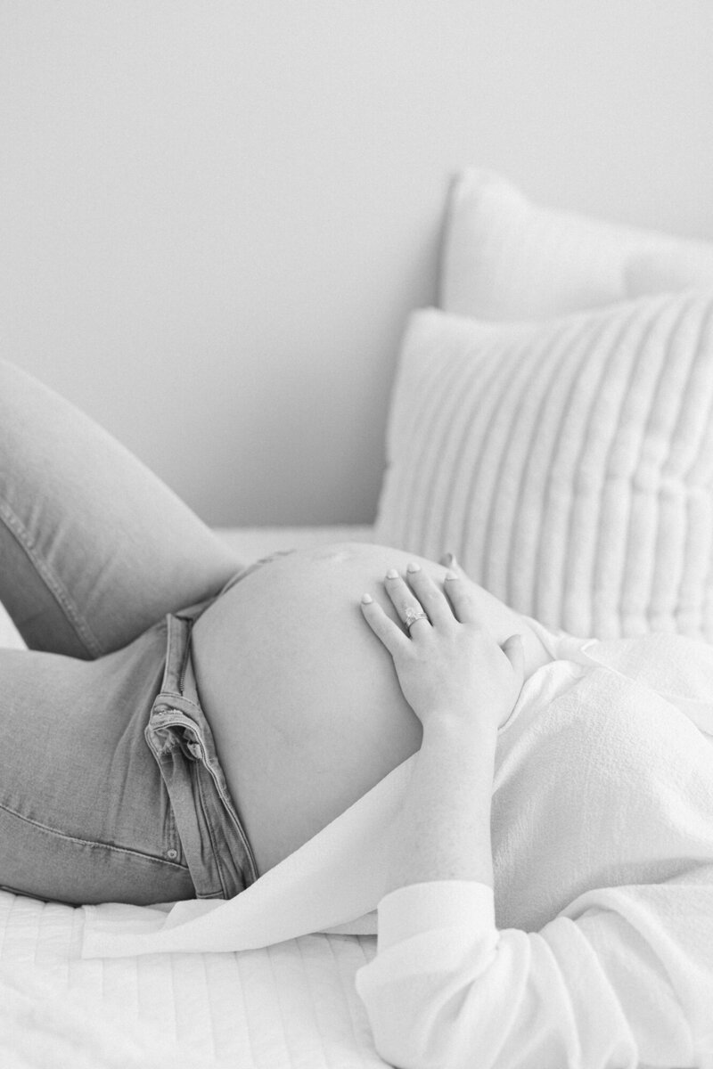 Black and white portrait of a bare pregnant belly taken by missy marshall