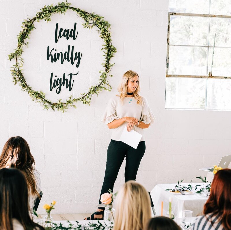 Andrea Wilde is the CEO and founder of the LIVE BIG Collective and is speaking to a large group of women in Utah