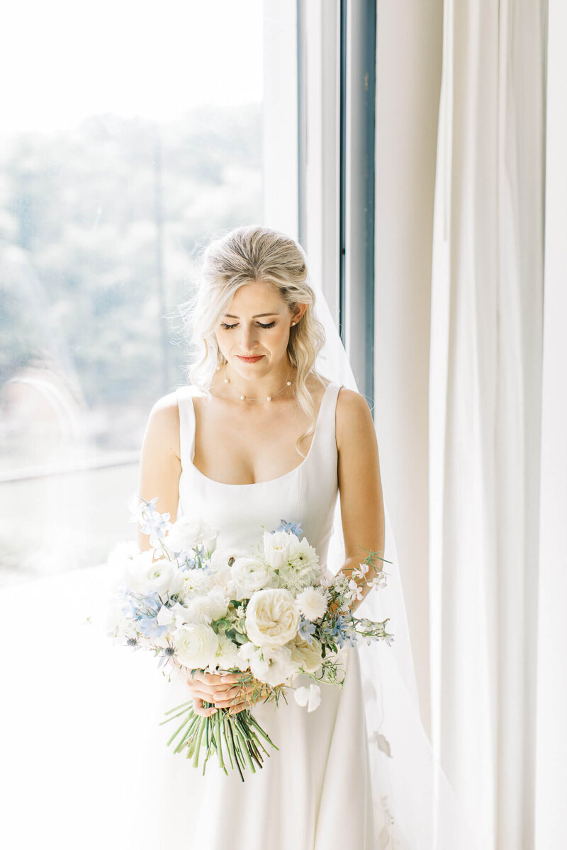 Summere white wedding bouquet with. something blue