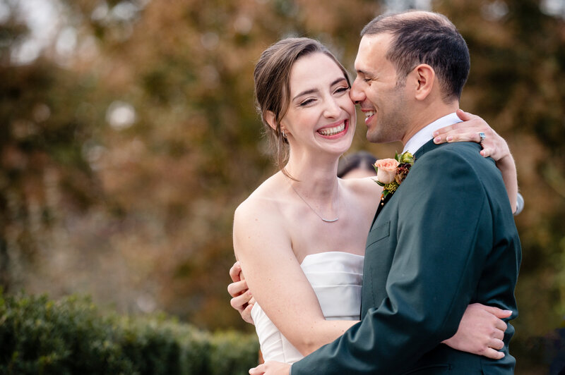 A man and woman embrace on their wedding day