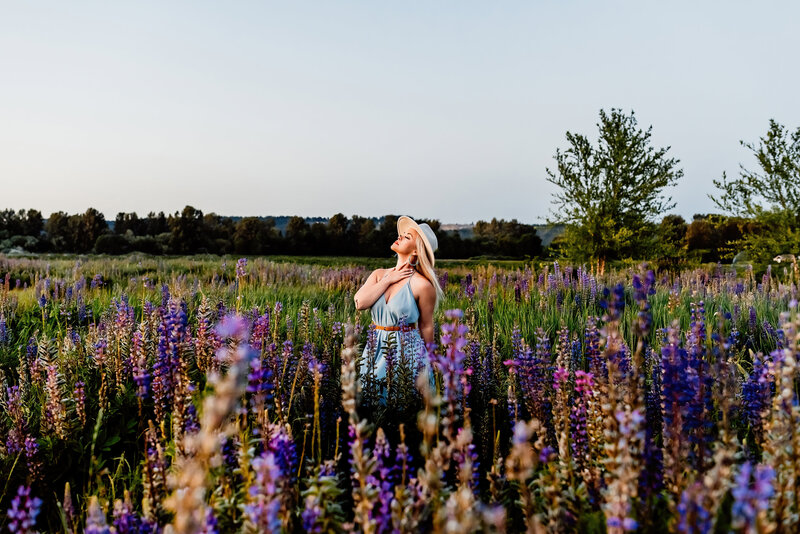 a country singer in a field of wildflowers