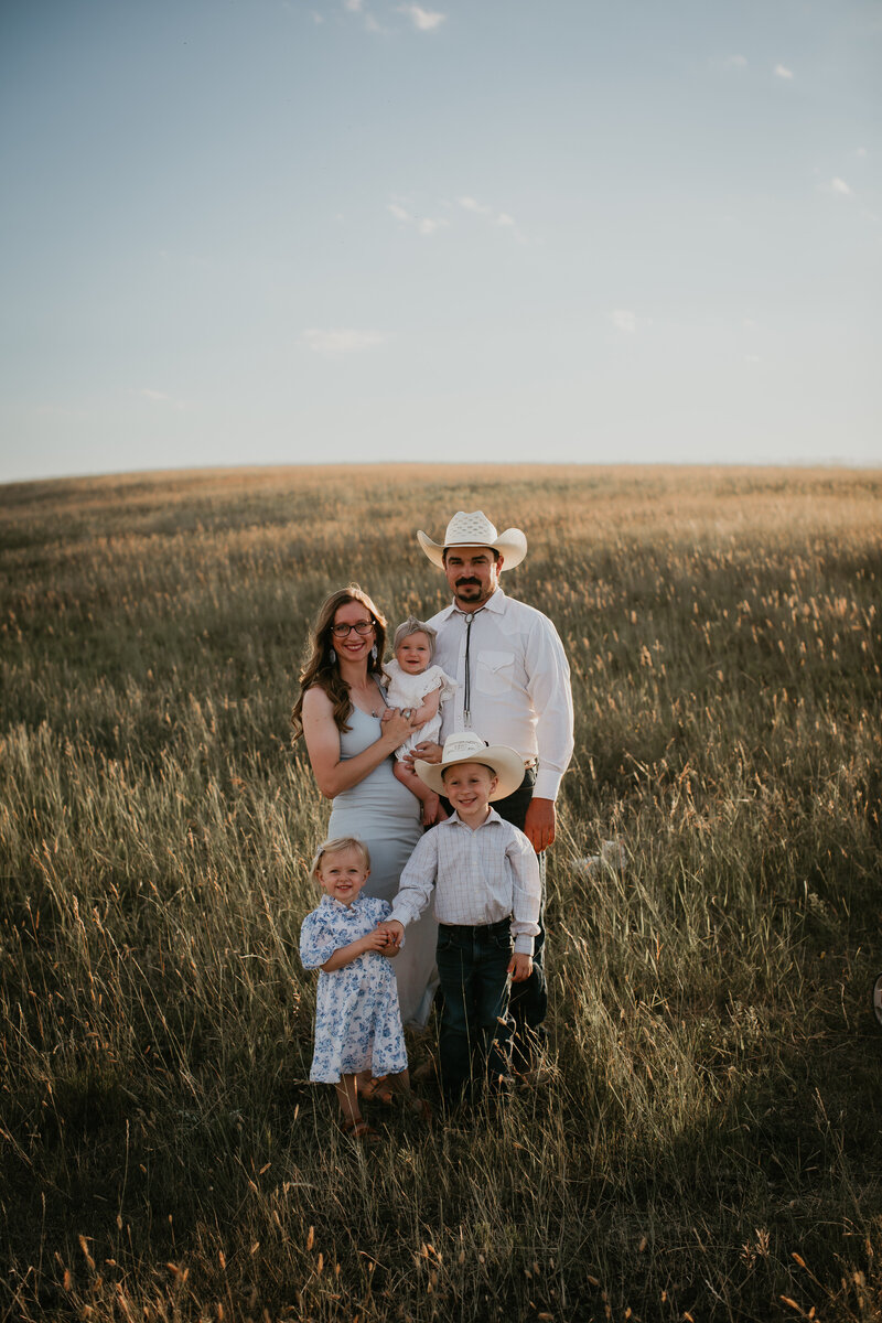 A family photo session on Chelise's own land in Vida, MT, showcasing the joy and connection of her family. Capturing precious moments of love in the wide-open Montana countryside, perfect for families wanting authentic, outdoor family portraits.