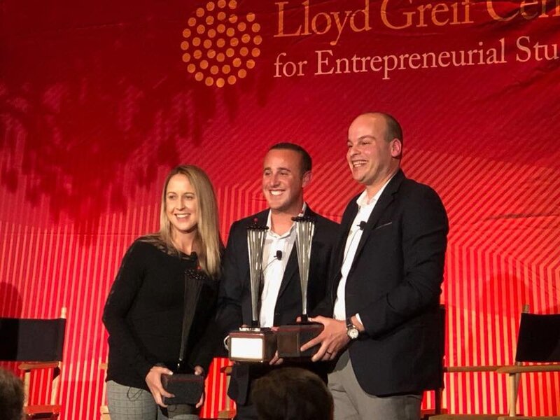 Startup advisor Darren Berkovitz receiving entrepreneurship award on stage