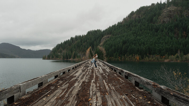 Couple on a trestle bridge in Campbell River during their engagement session by latitude 49 photography