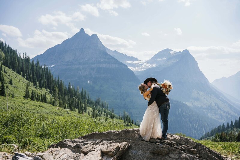 Bride and groom swooning at Paradise Meadow in Glacier National Parn