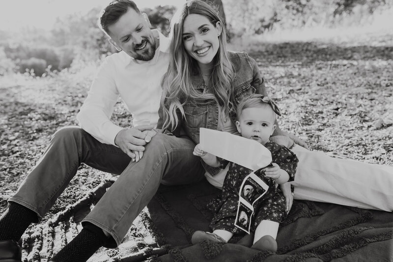 Family of Four walks together in the hills of mount diablo laughing