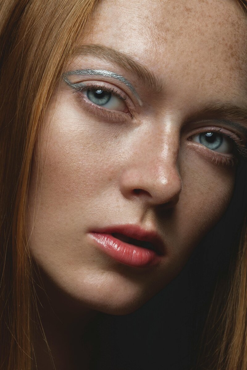 woman with makeup staring at the camera