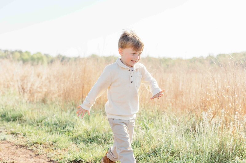 Boy running during Ashburn, VA photography