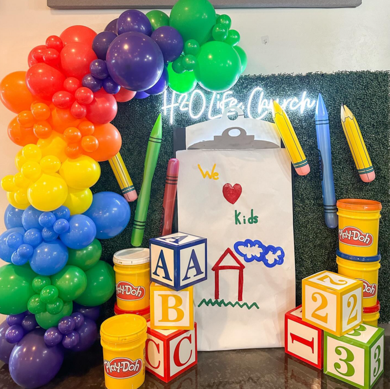 custom balloons and school themed backdrop