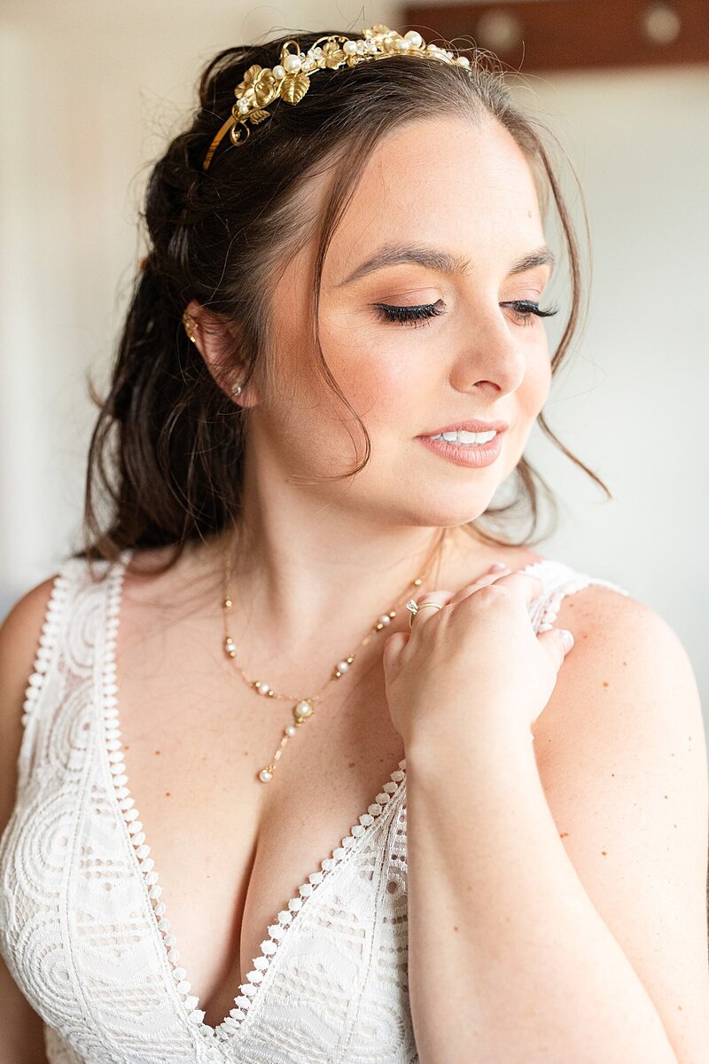 Bridal portrait of the bride in her dress in the bridal suite at Avonlea Farms.
