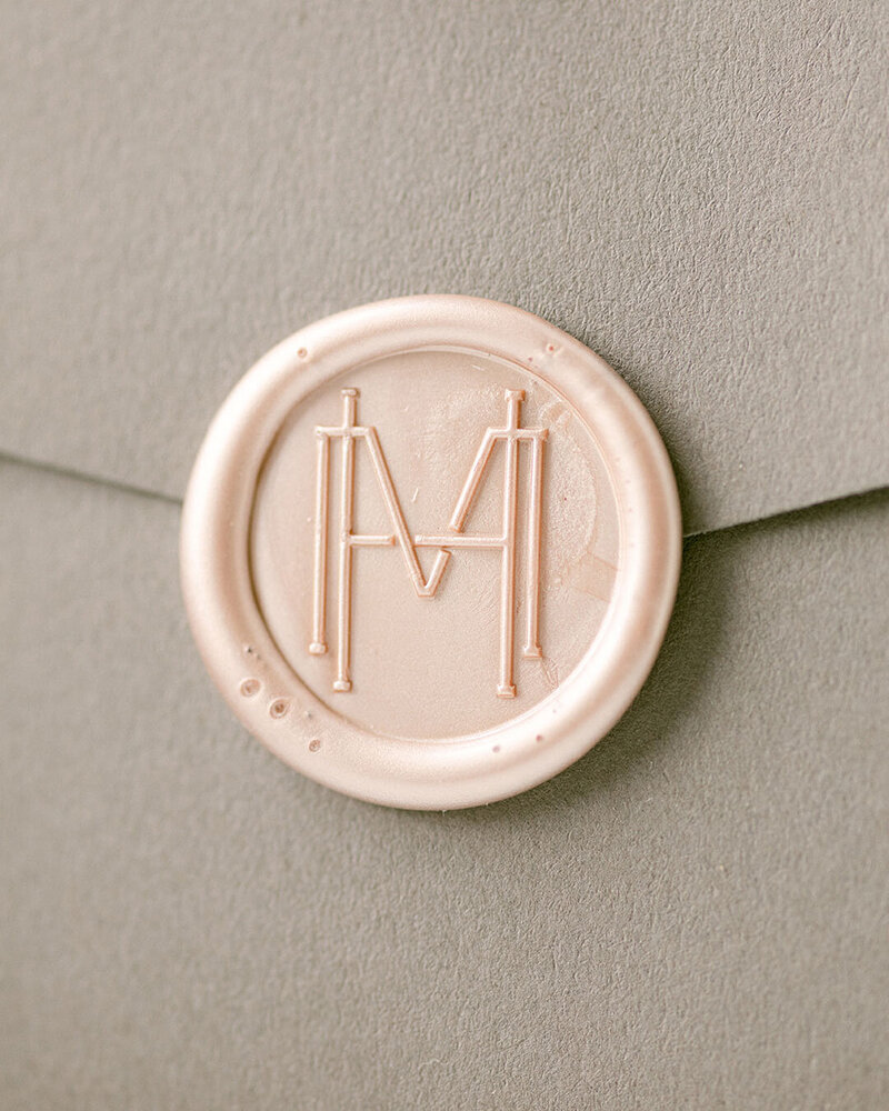 Bespoke wax stamp branding on envelope for a luxury cake designer brand.