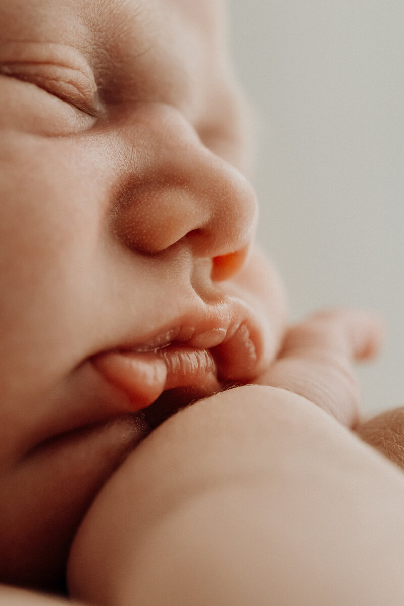 A macro close up of a newborn babies lips taken during a portrait photoshoot with Christchurch photographer Lucy Jane Photography