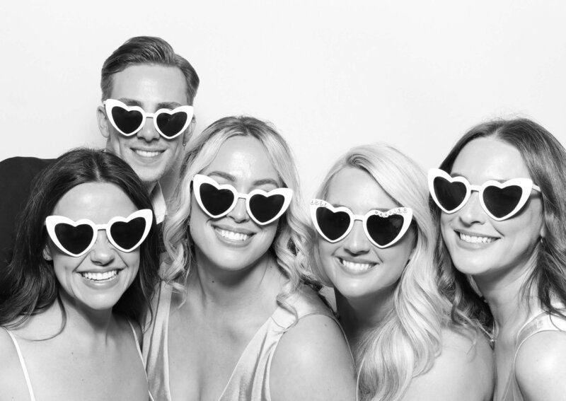 guests using heart shaped glasses during the photo booth picture