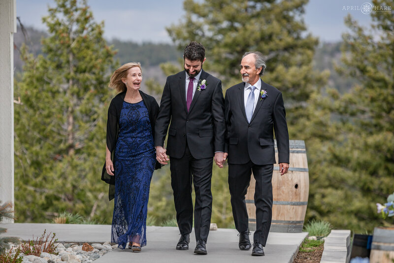 Groom Walks His Parents Down the Aisle at The Woodlands Barn in Colorado